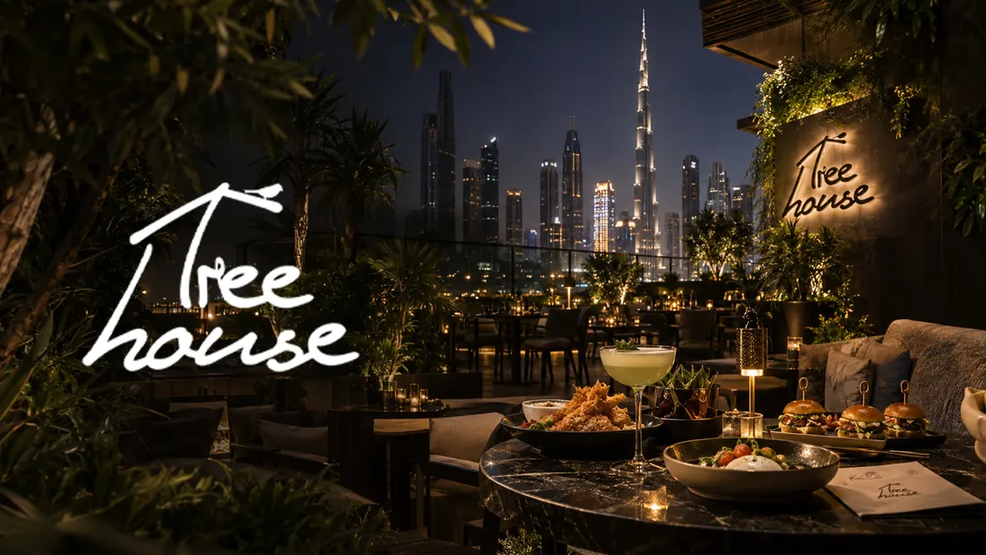 Cover board: the Tree House script over a rooftop table with the Burj Khalifa behind it at dusk.